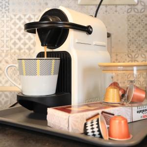 a coffee maker sitting on top of a tray at Vita Apartmanok in Hévíz +20 photos