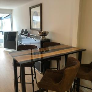 a dining room with a table and chairs at Eifelloft&Spa in Adenau