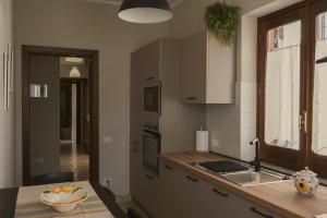a kitchen with a sink and a counter top at Hera Home B&B in Serra Pedace +21 photos