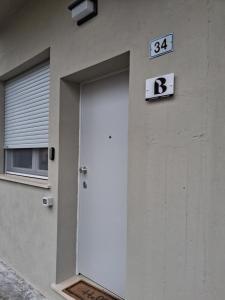 a door to a building with a sign on it at Il Piano B in Molinella