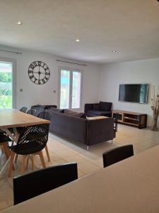 a living room with a couch and a table at La Motte in La Motte