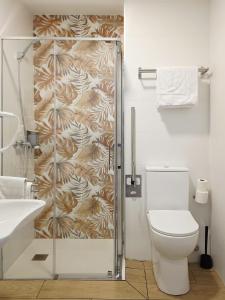a bathroom with a shower and a toilet at Bilbao ROOMS & KITCHEN Zabalburu in Bilbao +66 photos