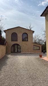 a large building with windows on the side of it at Podere Gorette in Poggibonsi