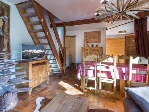 a living room with a table and a dining room at Studio 3*** aux pistes, cheminée, animaux admis, garage - FR-1-304-111 in La Clusaz