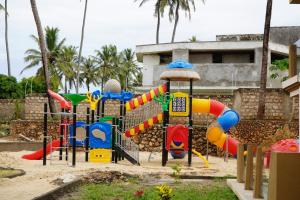 a playground in front of a building at Tulivu Beach Stays in Jeuri