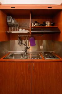 a kitchen with a sink and a counter top at Villa Andromeda in Amorgos