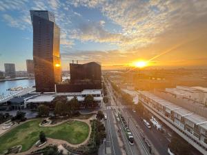 an aerial view of a city with a tall building at Cozy and Comfortable 2BR Apartment with master Ensuite and bathrooms in Melbourne