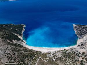an aerial view of the blue water in the mountains at Villa Ourania near Myrtos in Divarata
