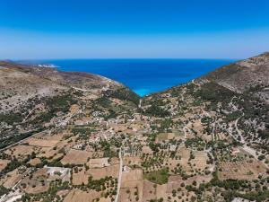 an aerial view of a village on a mountain at Villa Ourania near Myrtos in Divarata