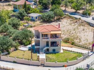 an aerial view of a house with a yard at Villa Ourania near Myrtos in Divarata
