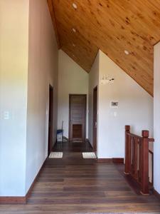 an empty room with a wooden ceiling and a hallway at R Chai in Countach Da