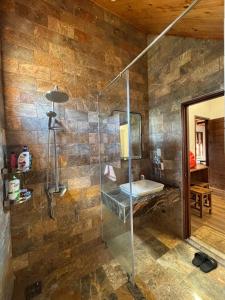 a bathroom with a glass shower and a sink at R Chai in Countach Da +15 photos