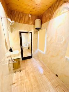 a bathroom with a sink and a mirror at Ballygunge 2BHK 2000sqft flat main road in Kolkata +25 photos