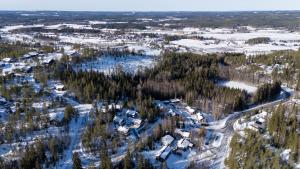an aerial view of a village in the snow at Villa Magnolia 1 Himos in Jämsä