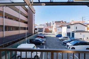 a view from a balcony of a parking lot at 逸泊居 in Osaka