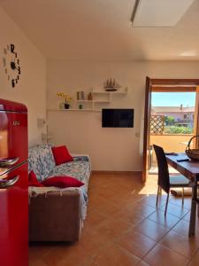 a living room with a couch and a table at Da Luca in Càbras