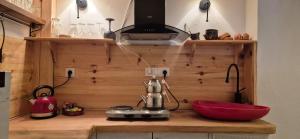 a kitchen with a mixer on a wooden counter at Kelebek Ayvalık in Ayvalık
