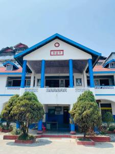 a building with a sign that reads ut hospital at Kalimpong Heritage Homestay in Kalimpong +7 photos