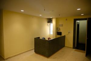 a lobby with a podium in the middle of a room at hotel nemi residency jagdalpur in Jagdalpur