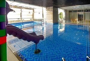 a swimming pool with a slide in the middle of it at Mermaid-Oasky-50m to ThápTamThắng&Biển in Vung Tau