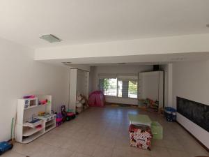 a living room with a large room with toys in it at Rincon del Valle in Merlo
