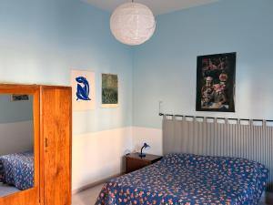 a bedroom with a bed and a lamp at Il Barbagianni in Chieuti