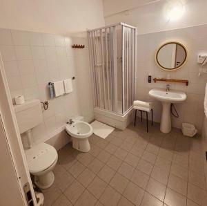a bathroom with a toilet and a sink and a shower at Hotel Elisabetta in Sestri Levante