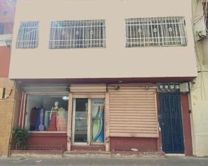 a store front of a building with a door at Colonial Zone 2BR Apartment Prime Location in Santo Domingo