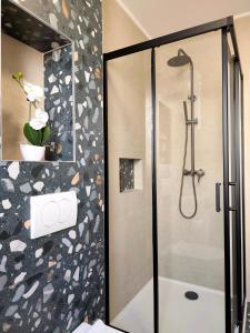 a shower with a glass door in a bathroom at Nashi Garden Apartment Split with City View & Parking in Solin +29 photos