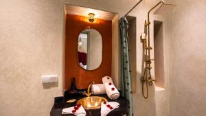 a bathroom with a sink and a mirror at Riad Sultan Suleiman & Spa in Marrakesh +106 photos
