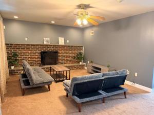 a living room with two couches and a fireplace at Get Away Casino in Bensalem