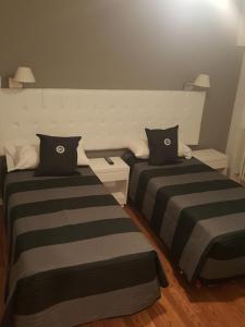 Voodi või voodid majutusasutuse Dodo Suites toas