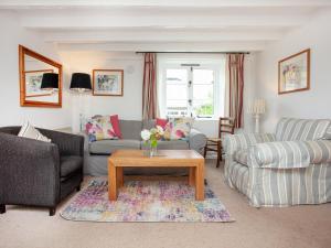 a living room with two couches and a coffee table at Tuckenhay, 1 Castle Cottage - Fck in Ashsprington +40 photos