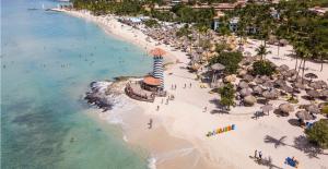an aerial view of a beach with a lighthouse at Ilaria Bayahibe By Mireya in Bayahibe