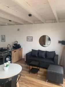 a living room with a couch and a table at Housing Las Lomitas in Villa Allende