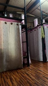 a group of bunk beds in a room at Baan Pai Hostel in Pai