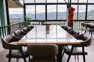 a table and chairs in a room with a view at Serenity Busay Room 8 in Cebu City