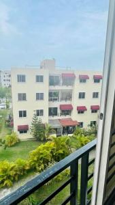 a view of a large building from a balcony at Apartment in a comfortable and quiet area in Pantoja
