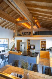 a kitchen and dining room with a table and chairs at Chalet Zaferna in Mittelberg +62 photos