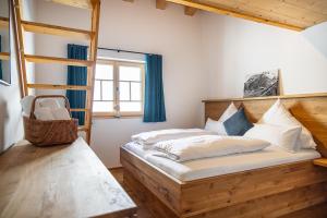 a bedroom with two bunk beds and a window at Chalet Zaferna in Mittelberg