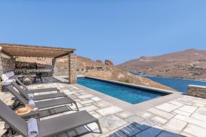 a villa with a swimming pool with a view at Lithi House in Grionísi