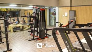 a gym with several treadmills and other equipment at Heron Marinho Flats in Campina Grande