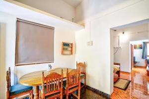 a dining room with a table and chairs at Anjuna Beach House in Anjuna +20 photos
