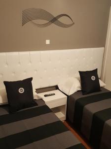 Voodi või voodid majutusasutuse Dodo Suites toas