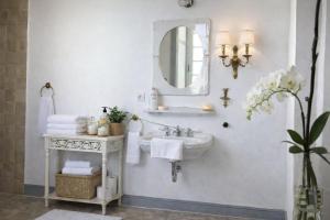 a white bathroom with a sink and a mirror at Chateau d'Isigny - Normandie - Country House in Isigny-le-Buat +18 photos