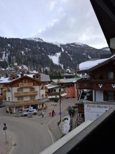 a view of a town with a mountain in the background at Campiglio Trilocale Cima Tosa in Madonna di Campiglio