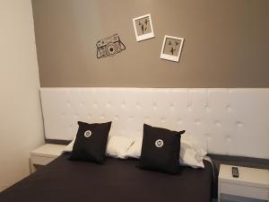 Voodi või voodid majutusasutuse Dodo Suites toas