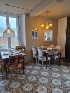 a dining room with a table and chairs at Vallee du Ton in Origny-en-Thiérache