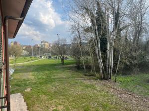 a view of a park with trees and buildings at Hotelleria di Ovada in Ovada