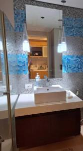 a bathroom with a sink and a mirror at Maison Brise Condominium Unit Pico De Loro Nasugbu in Nasugbu +20 photos